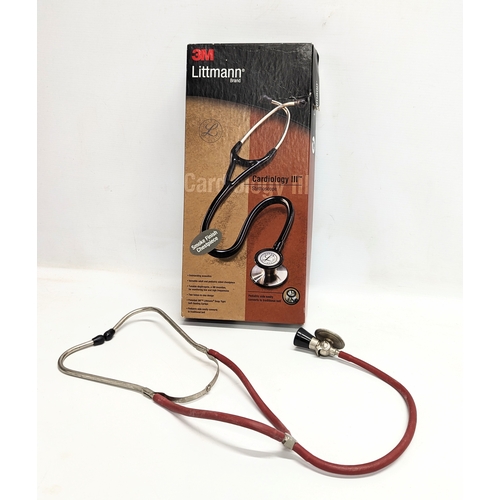 696 - A vintage stethoscope.