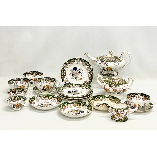 605 - 18 pieces of mid 19th century Victorian dinner ware. Teapot measures 28cm.