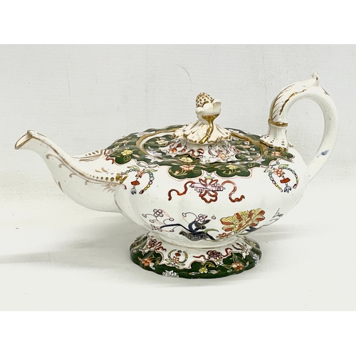 605 - 18 pieces of mid 19th century Victorian dinner ware. Teapot measures 28cm.