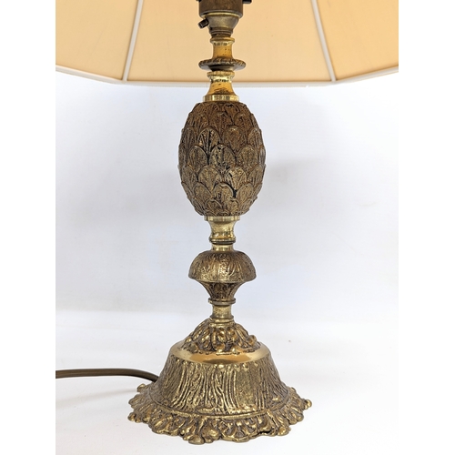 621 - A pair of ornate brass table lamps. 56cm