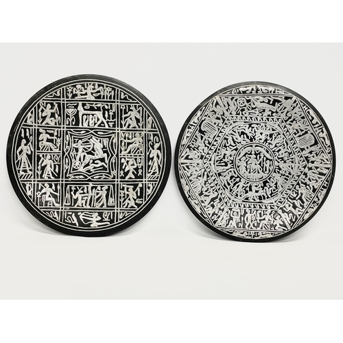 64 - A pair of late 19th century silver plated inlaid copper trays. 25cm