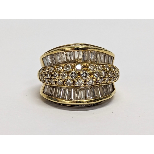 592 - An 18ct gold ring with diamonds.12.46gms