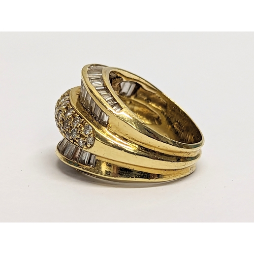 592 - An 18ct gold ring with diamonds.12.46gms