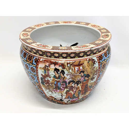 703 - A Chinese pottery jardiniere. 27x19.5cm