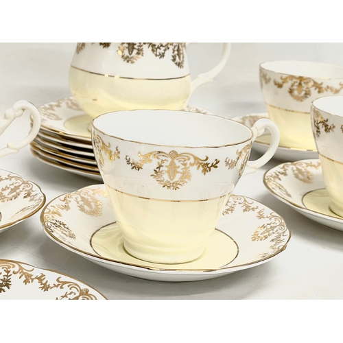 706 - A 19 piece Imperial tea set. 22k gold warranted.