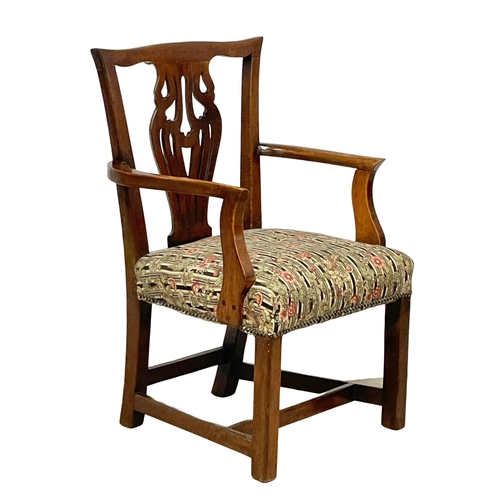 1010 - A late 19th century Chippendale style Elm and Beech armchair.