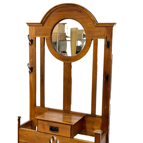 1019 - An early 20th century Arts & Crafts hallstand. Circa 1900. 93x34x193cm