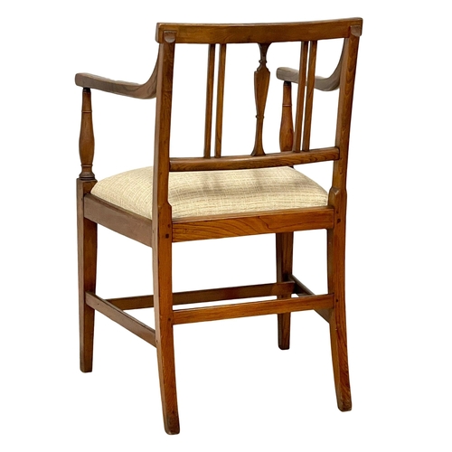 1024 - A Georgian Elm and Beech armchair. Circa 1810-1820.