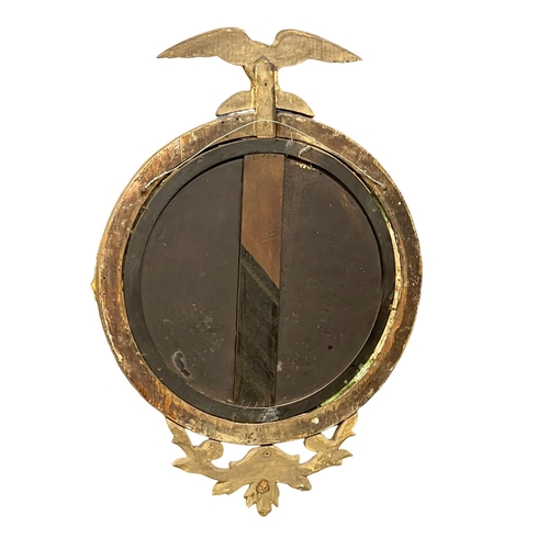 1032 - A Regency gilt framed convex mirror. Circa 1810. 57x82cm