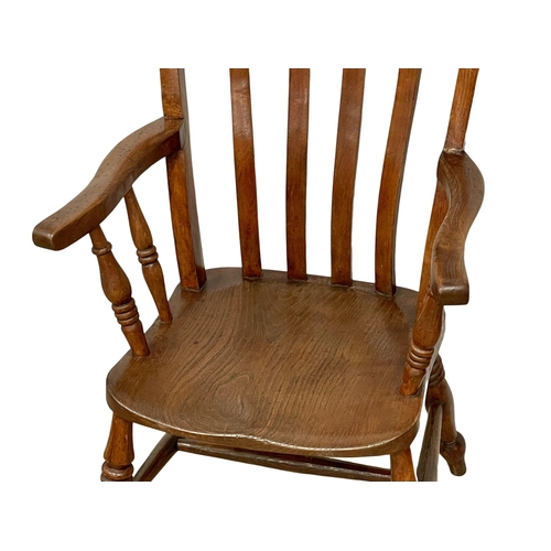 1037 - A Victorian elm and beech high back kitchen armchair.