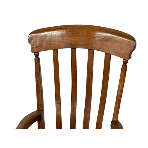 1037 - A Victorian elm and beech high back kitchen armchair.