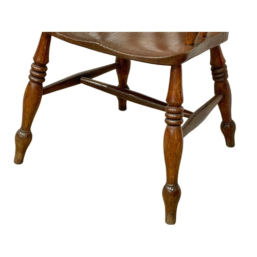 1037 - A Victorian elm and beech high back kitchen armchair.