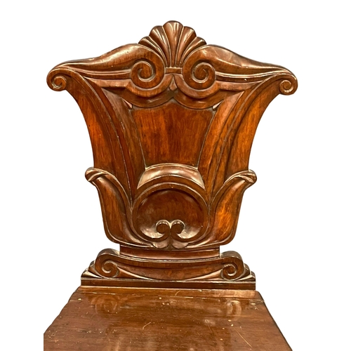 1038 - An Early Victorian mahogany hall chair.