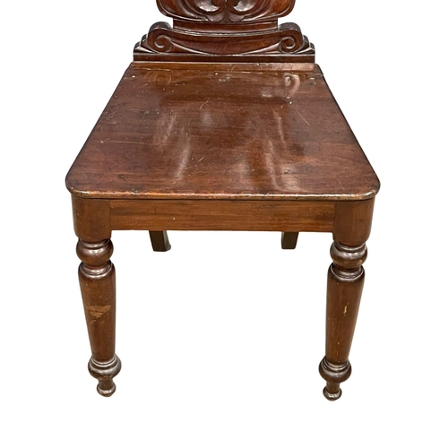 1038 - An Early Victorian mahogany hall chair.