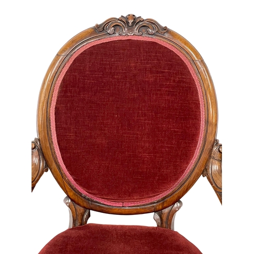 1040 - A Victorian rosewood gents parlour chair on Cabriole legs.