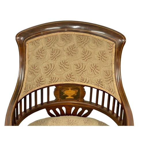 1046 - An Edwardian inlaid mahogany tub armchair.