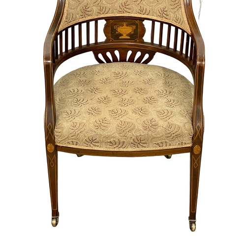 1046 - An Edwardian inlaid mahogany tub armchair.