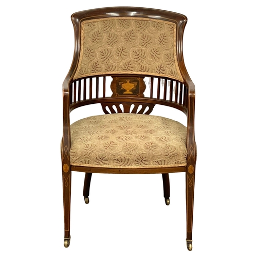 1046 - An Edwardian inlaid mahogany tub armchair.