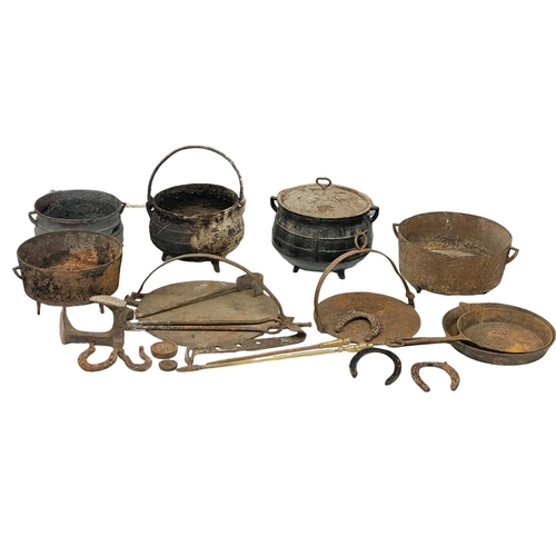 396 - A quantity of 19th century cast iron pots and pans etc.