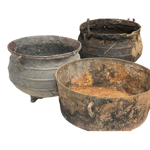 396 - A quantity of 19th century cast iron pots and pans etc.