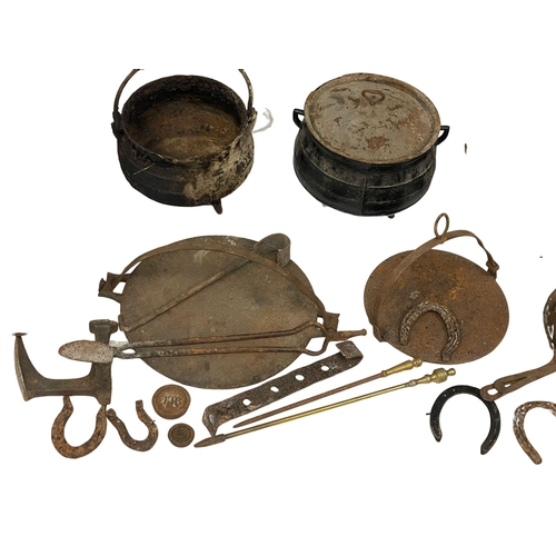 396 - A quantity of 19th century cast iron pots and pans etc.