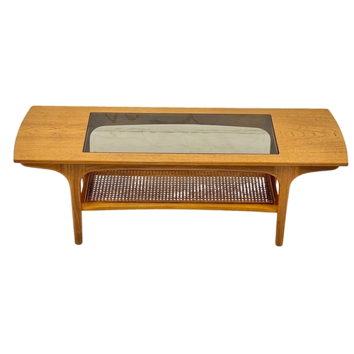 804 - A McIntosh Mid Century teak 2 tier coffee table with glass top. 1970’s. 120x41x40cm