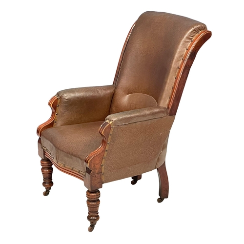 805 - A Victorian gents armchair with vintage leather. Circa 1880.