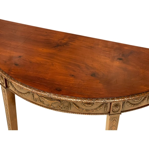 818 - A late 19th century mahogany Adams style demi-loon side table. Circa 1880. 118x54x74cm