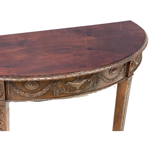 818 - A late 19th century mahogany Adams style demi-loon side table. Circa 1880. 118x54x74cm