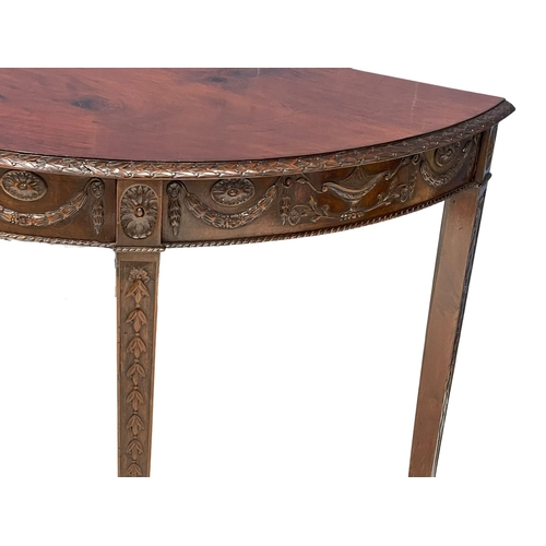 818 - A late 19th century mahogany Adams style demi-loon side table. Circa 1880. 118x54x74cm