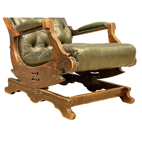 823 - A Victorian deep button leather rocking chair. Circa 1890.