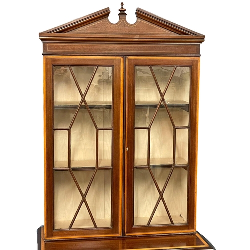 824 - A late 19th century Sheraton Revival inlaid mahogany bookcase. Circa 1880-1890. 76x39x200cm