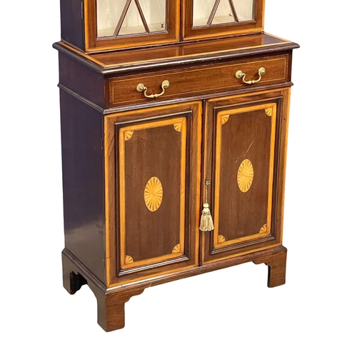 824 - A late 19th century Sheraton Revival inlaid mahogany bookcase. Circa 1880-1890. 76x39x200cm