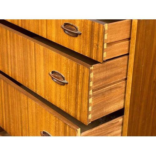 833 - A Mid Century Tola wood tallboy chest of drawers by Elliots of Newbury with simulated rosewood handl... 