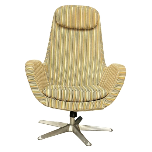 843 - A 1970’s Mid Century swivel chair with stool