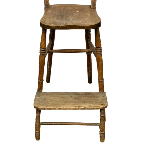 848 - A Victorian Elm and Beech clerks chair. 106cm