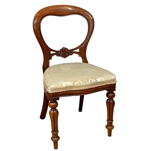 851 - A set of 9 Victorian style mahogany balloon back dining chairs on reeded legs.