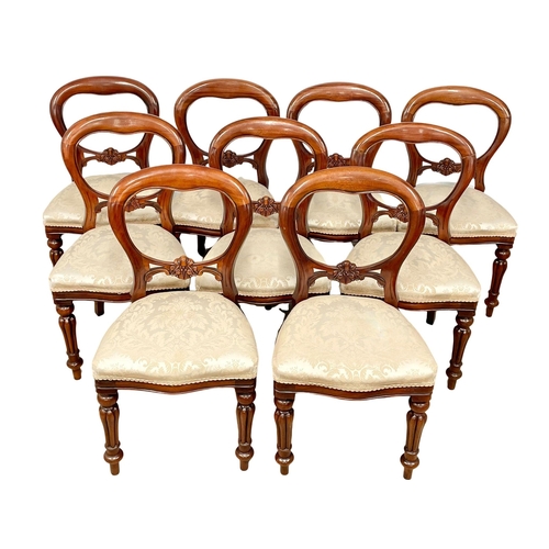 851 - A set of 9 Victorian style mahogany balloon back dining chairs on reeded legs.