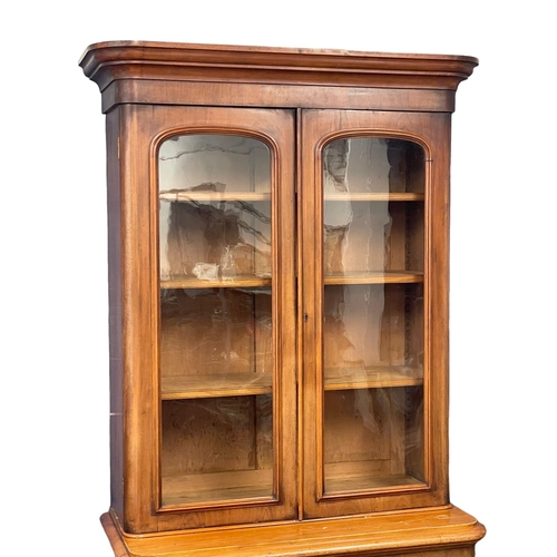 855 - A large Victorian mahogany bookcase. 109x52x209cm