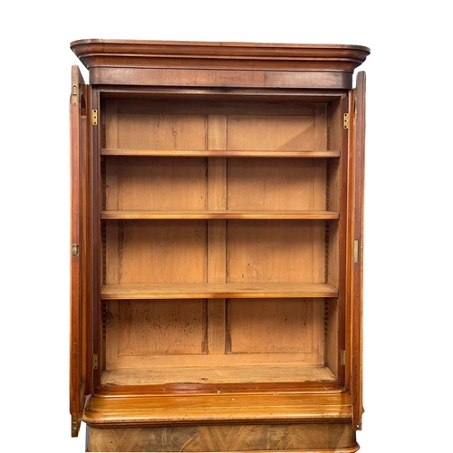 855 - A large Victorian mahogany bookcase. 109x52x209cm