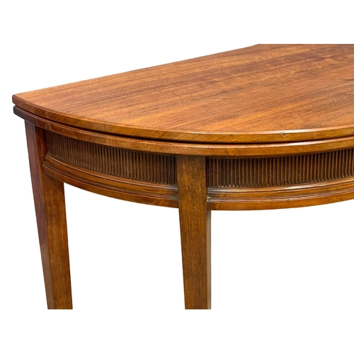 856 - A late 19th century Gillows of Lancaster walnut turnover games table, in the Georgian style. Circa 1... 