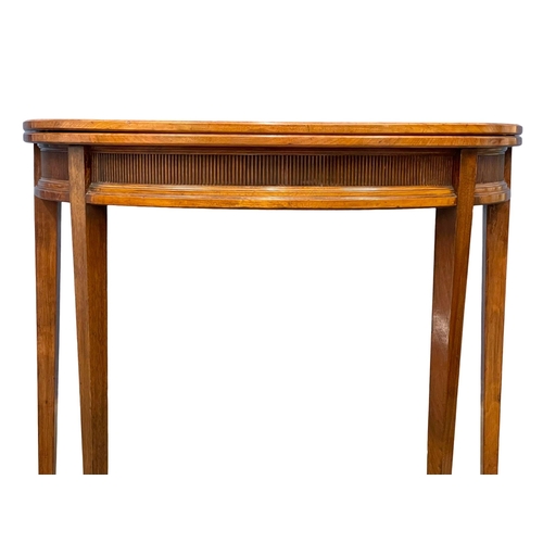 856 - A late 19th century Gillows of Lancaster walnut turnover games table, in the Georgian style. Circa 1... 