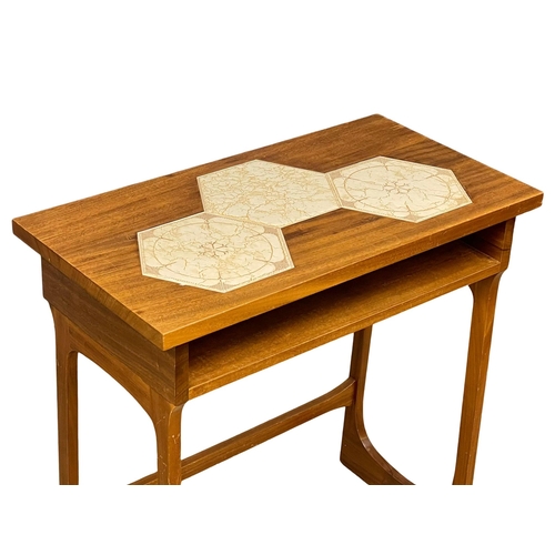 867 - A Mid Century teak hall table with tile top. 72x38x74cm