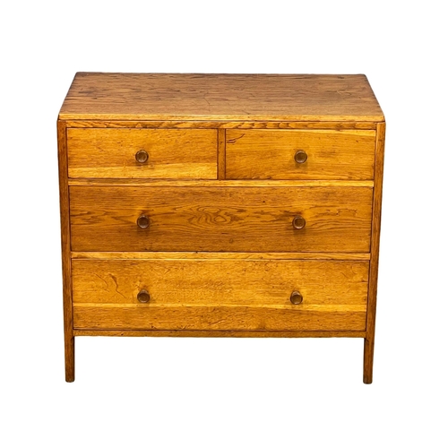 869 - An early to mid 20th century Heals style oak chest of drawers by Angus Menstrie. 91x50x82cm