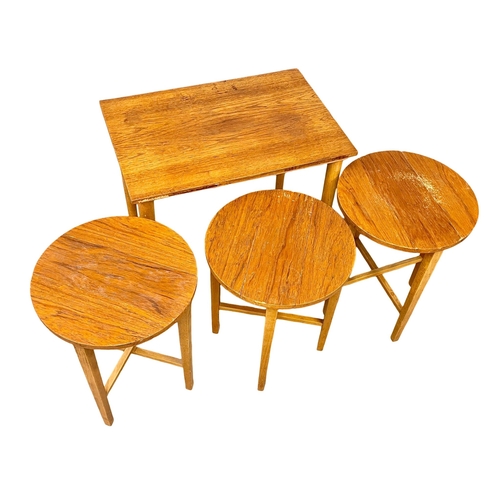 874 - A Danish Mid Century teak nest of tables designed by Poul Hundevad