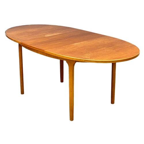 882 - A McIntosh Mid Century teak extending dining table. Open 196cm. Closed 151x95x76.5cm