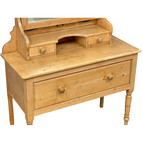 887 - A Victorian pine dressing table. 102x45x156cm