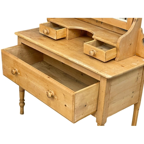 887 - A Victorian pine dressing table. 102x45x156cm