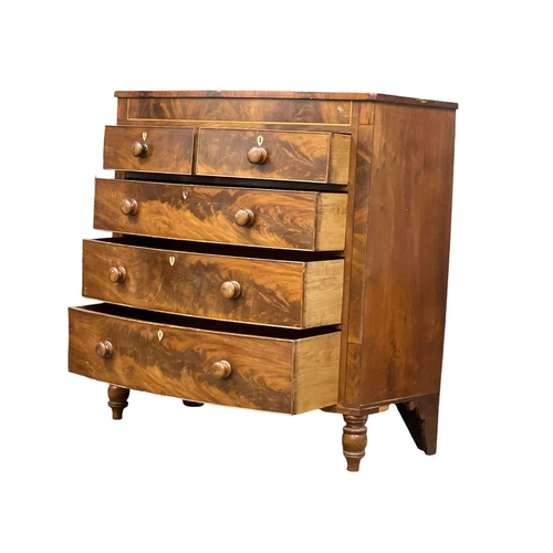 909 - A large Victorian inlaid mahogany bow front chest of drawers. 120x56x122cm