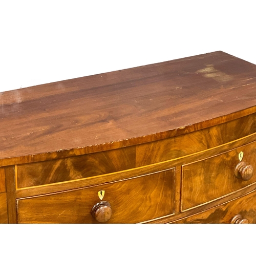 909 - A large Victorian inlaid mahogany bow front chest of drawers. 120x56x122cm